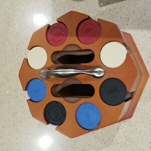 Michael Graves Poker set sans cards.  Beautiful cherry holder w/stainless handle